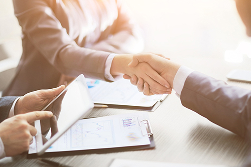 Business people shaking hands, finishing up a meeting